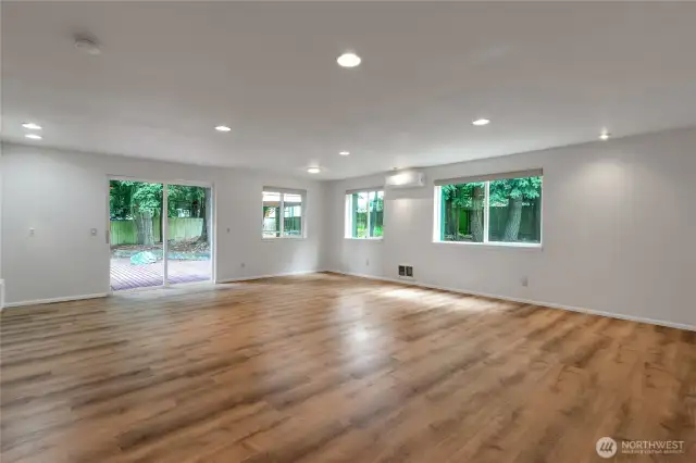 2nd picture of great room that opens directly to a large deck perfect for indoor-outdoor living, summer BBQ's, or relaxing with a view of the backyard.