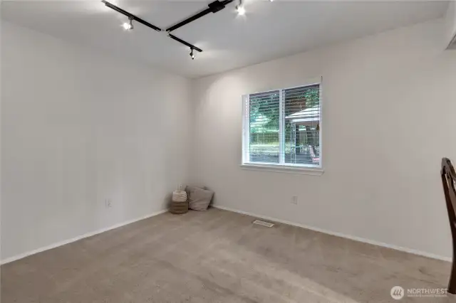 Second bedroom located the opposite side of the home features a built in desk ideal for a home office or study space.  The desk can easily be removed to restore a large closet, offering flexible use to fit your needs.