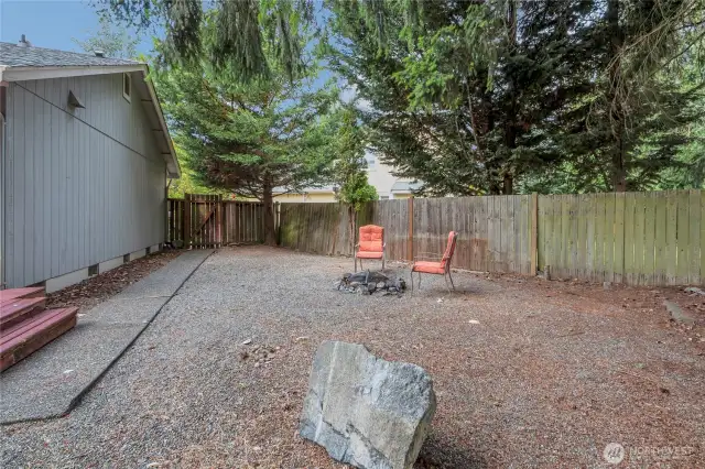 Paved walkway leads you to the side gate to the front yard.