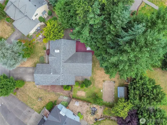 Drone view showcases the full layout of the property.  .29 acre, RV parking, shed, deck.  A perfect visual of how much space and potential this home truly offers.