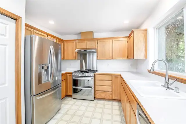 Gas double oven with blue interior and gas cooktop.