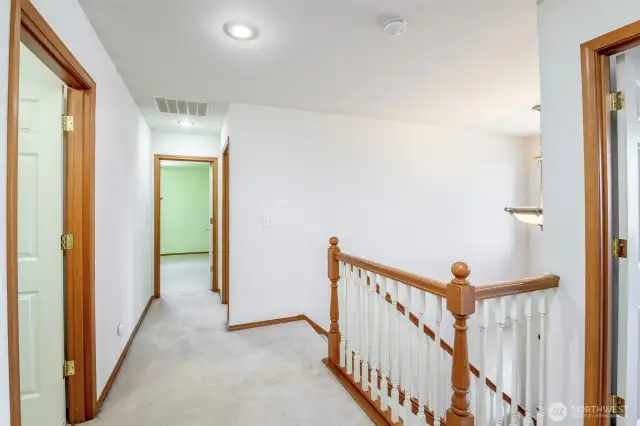Upstairs landing looking toward primary suite