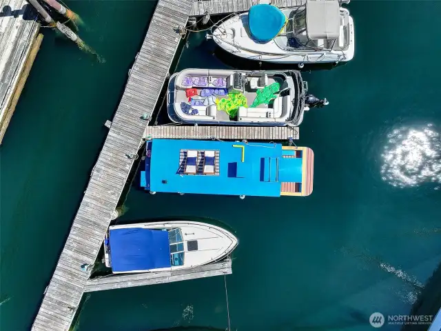 From above, the S.S. Guppy’s vibrant profile stands out in its secure Westlake slip, part of a friendly, gated marina on Lake Union.