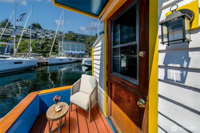 The petite aft deck, recently refreshed with a new awning, offers a perfect perch for morning coffee or sunset wine, with the gentle lap of Lake Union just below.  Would you like me to continue through all exterior shots first, then switch to the interior in sequence with the floorplan?