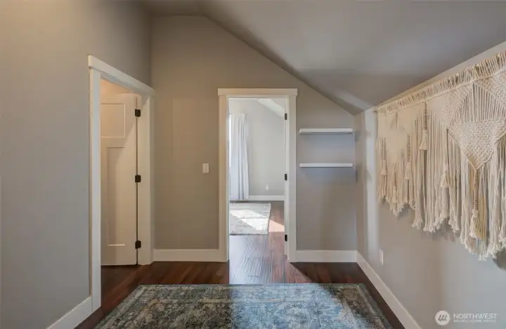Landing between the two upper bedrooms with full bath