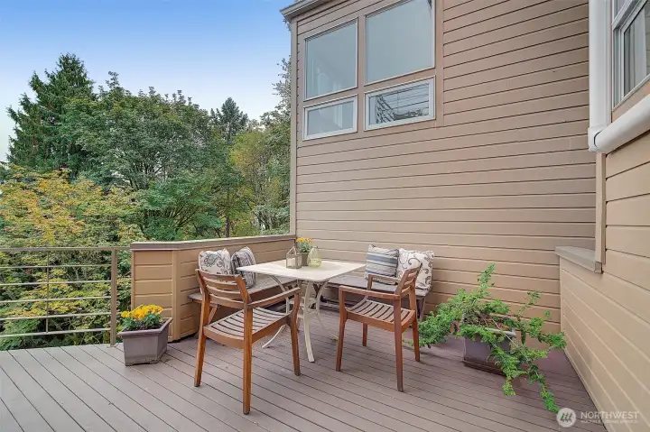 Entertainment sized deck off main floor to take the gathering out amongst the trees & views.
