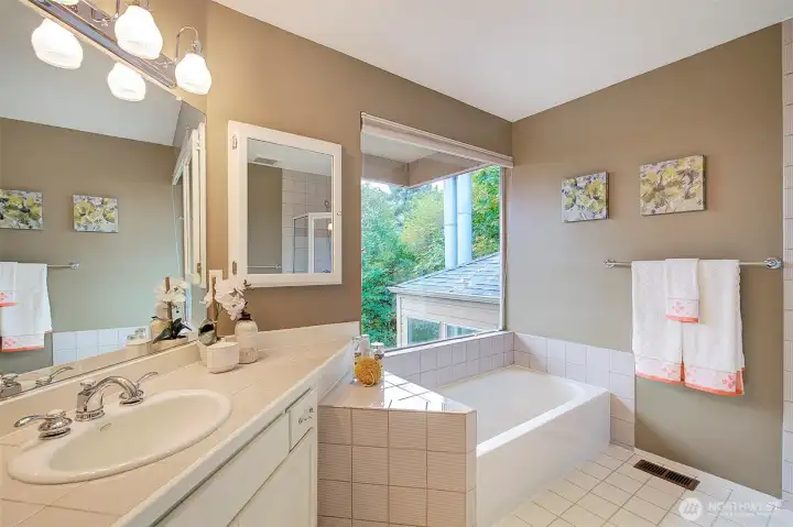 Primary bath with soaking tub and shower, and views!