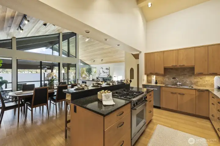 Island Kitchen with all stainless steel appliances including Dacor gas cooktop, Sub Zero frig + wine/beverage cooler