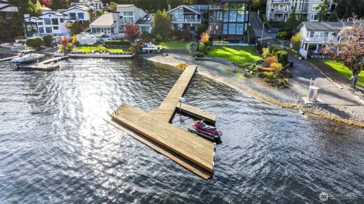 Large, shared dock with water ski ledge