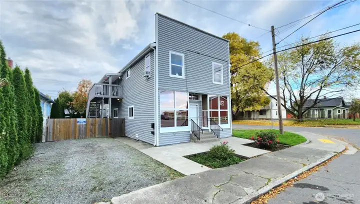 Beautiful Front of the Triplex with custom windows. comfortable front parking space off of walnut