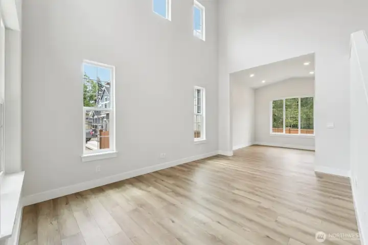 Formal living room to dining room view. Pic of similar home, colors and materials may vary