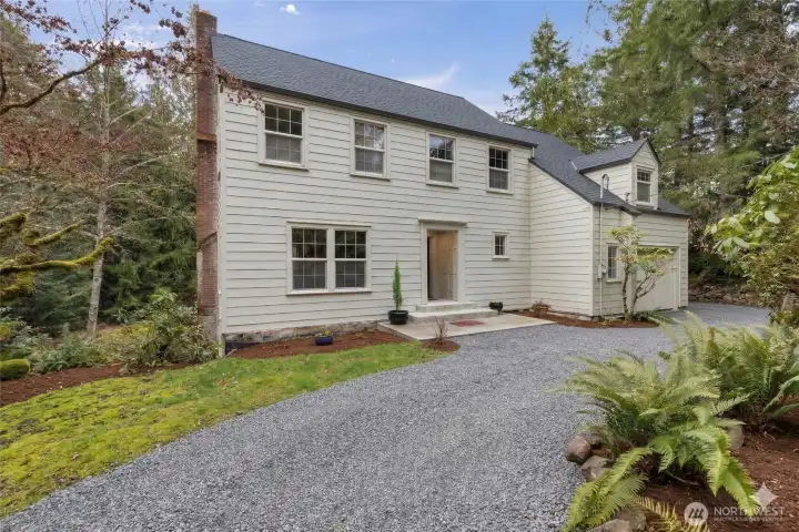 Closer front view of home showing new roof to be installed prior to closing.