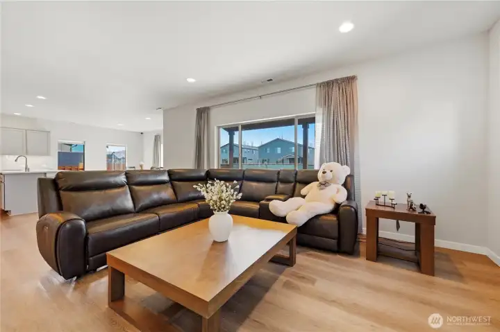 Open layout connecting seamlessly to the kitchen and dining areas.