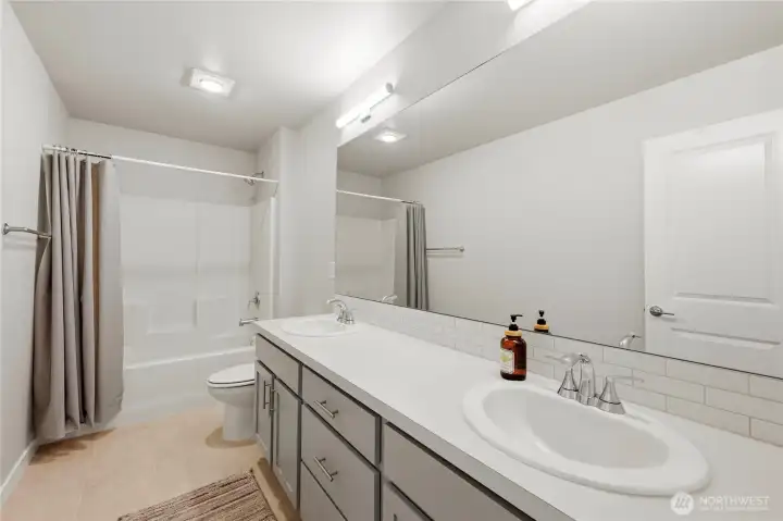 Full bathroom with clean modern finishes.