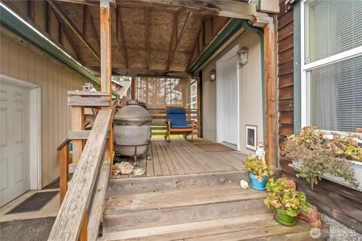 Breezeway between the garage and the house and front porch.