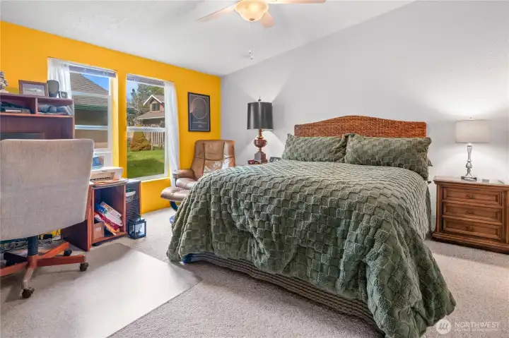 The primary bedroom is located on the opposite side of the other two bedrooms for added privacy.