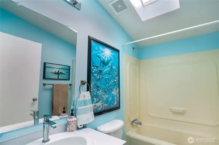 The second full bathroom is accessed from the hallway to the family room and 2nd and 3rd bedrooms. The second full bathroom is accessed from the hallway to the family room and 2nd and 3rd bedrooms.