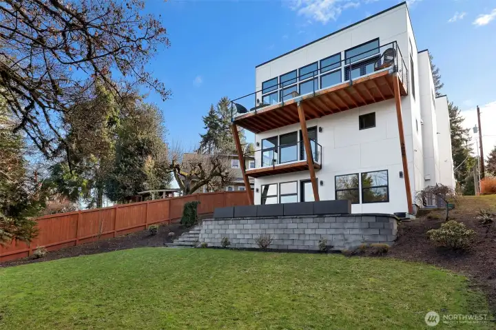 Three story home with views of Lake Washington on each level. Two decks off the second story main living areas and one deck off the primary bedroom on the main floor.