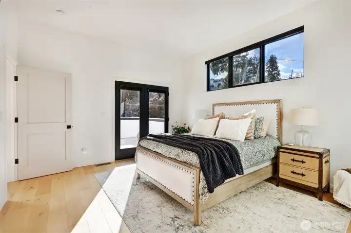 This bedroom is on the upper level and has a door out to the deck.