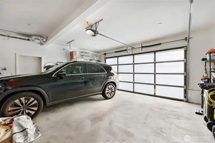 Two car garage with EV charger.