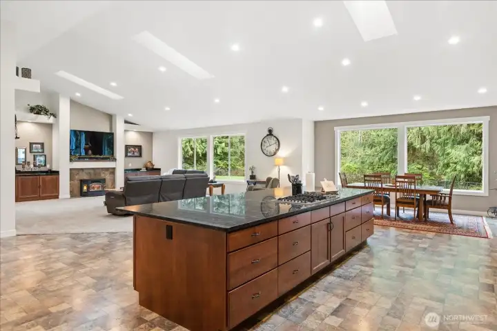 Vaulted ceiling, skylights & custom cabinetry in great room, kitchen and dining. Vaulted ceiling, skylights & custom cabinetry in great room, kitchen and dining.
