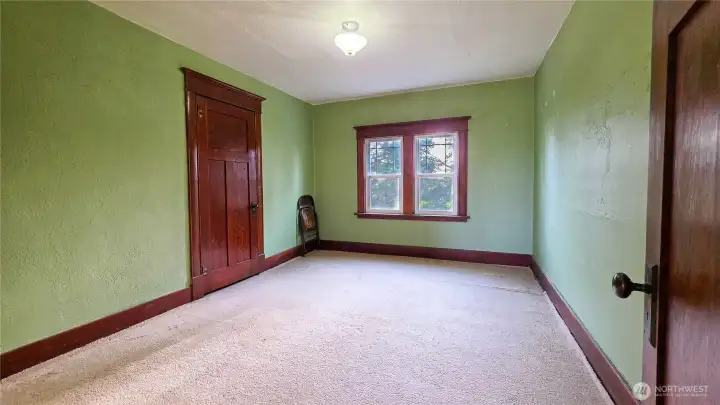 Upstairs third bedroom located on the west side of the home, featuring a double window with great western views..  Great west view.