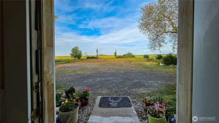 Bring your biggest dreams to life right here! Take a look at this spectacular view from the east entrance. This massive, flat field was formerly used for wheat, making it the ultimate blank canvas for your imagination. Whether you are dreaming of a mini-farm, equestrian setup, a massive shop, or just enjoying your own private slice of Waterville, this property delivers.