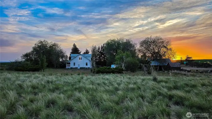 Start your adventure today at this one-of-a-kind property that never ceases to amaze! Just look at this breathtaking sunset view. Imagine ending every single day looking out over your own private acreage as the sky lights up over the farmhouse and rustic outbuildings. This isn't just a home; it's the beginning of your next great chapter.