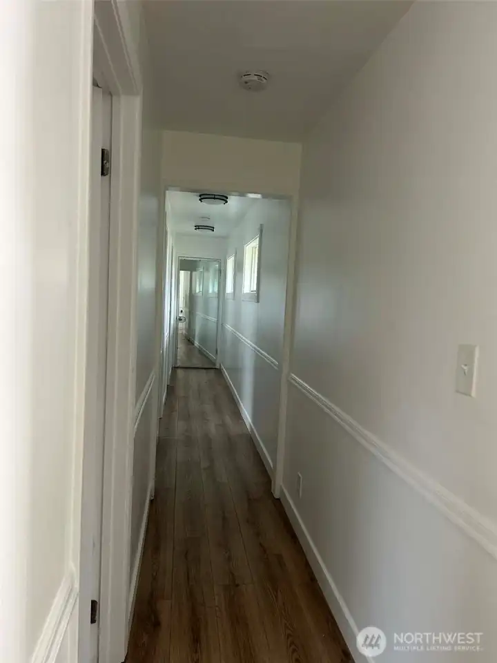 Hallway to 3 bedrooms and 2 bathrooms