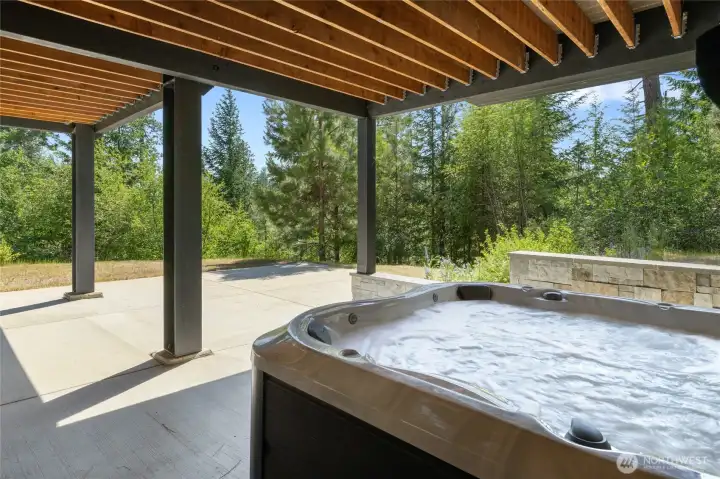 Downstairs patio with covered hot tub soace