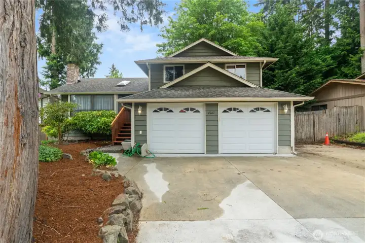 Beautifully maintained home nestled among mature trees in a  desirable Bothell neighborhood.