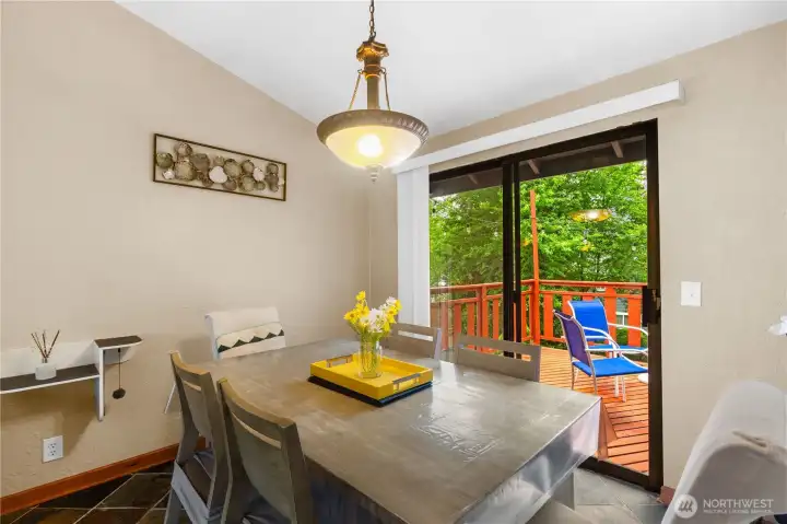 Dining room with direct deck access—great for summer entertaining.   Heated slate dining area.