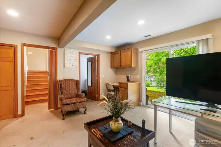 Spacious lower-level family room offers the perfect flex space for a media room, game room, home office, or guest retreat.
