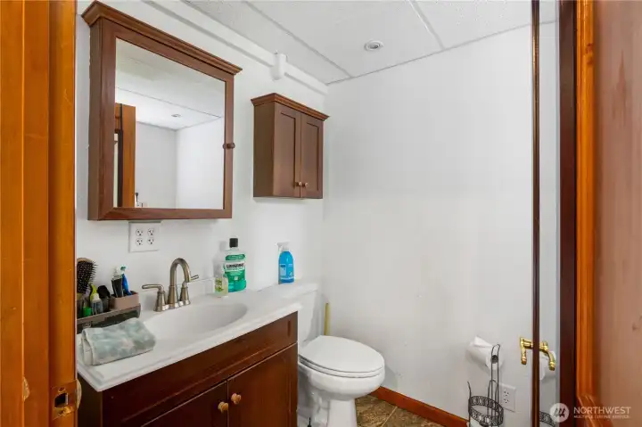Powder room and laundry room located off lower-level family room