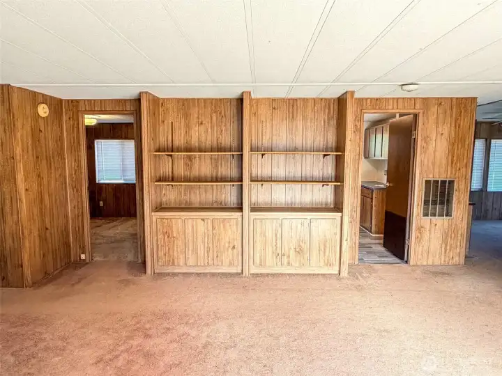 Looking across from the side slider, far left is Primary Suite, next door is 2nd bedroom, built in cabinets and the Utility.