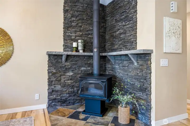 The wood stove is beautiful and will also help save on heating costs in the winter. The wood stove is beautiful and will also help save on heating costs in the winter.