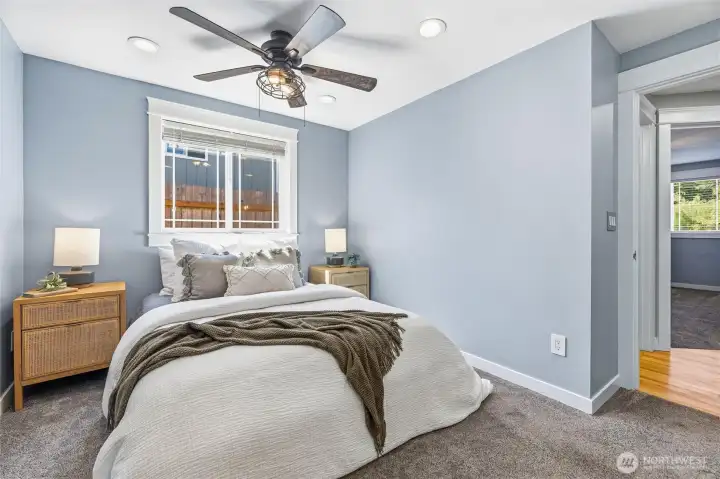 The primary suite is located at the end of the hall and features newer paint, carpet, and a ceiling fan to keep you cool. The primary suite is located at the end of the hall and features newer paint, carpet, and a ceiling fan to keep you cool.