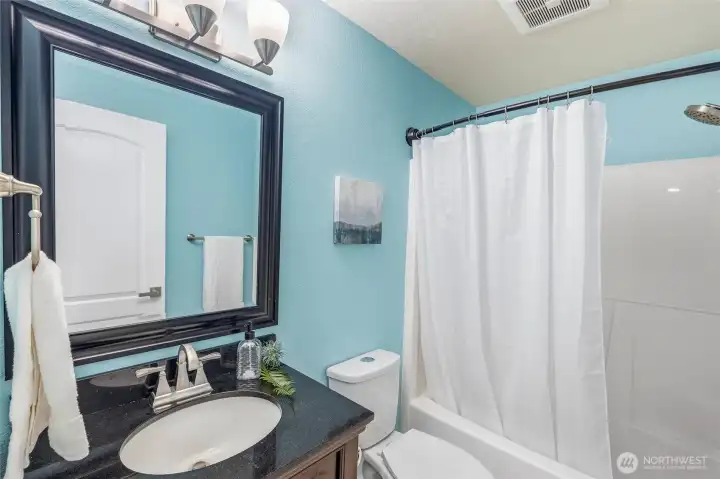 There's another fully updated guest bathroom located at the end of the hallway as well. There's another fully updated guest bathroom located at the end of the hallway as well.