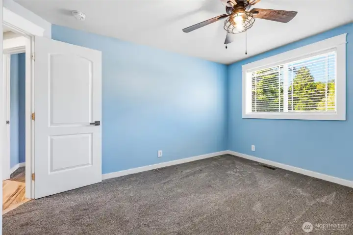 Guest bedroom #2 also faces the front of the house and has newer carpet, trim and a ceiling fan. Guest bedroom #2 also faces the front of the house and has newer carpet, trim and a ceiling fan.