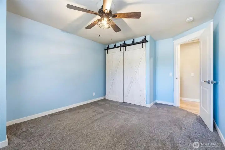 The second guest bedroom also has the sliding barn style closet doors. The second guest bedroom also has the sliding barn style closet doors.