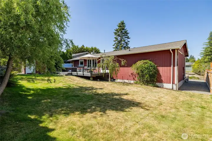 Mature trees create shade for hot summer days and added privacy. This shows the side of the house where a gate could go to completely fence in the backyard. Mature trees create shade for hot summer days and added privacy. This shows the side of the house where a gate could go to completely fence in the backyard.