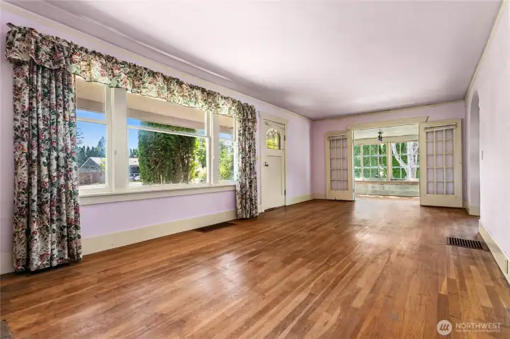 Original wood floors leading into the sun room Original wood floors leading into the sun room