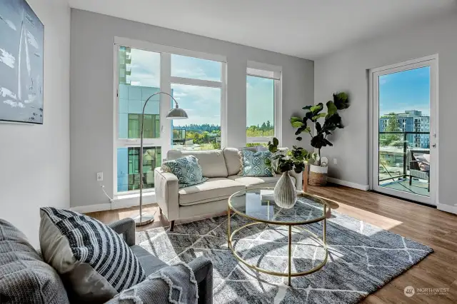 This corner unit boasts southwest-facing floor-to-ceiling windows, offering a serene courtyard view from the top floor.