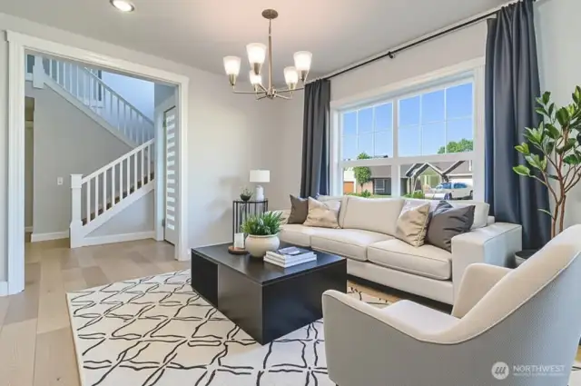 Virtually Staged. Spacious living room could easily serve as a formal dining room as well.