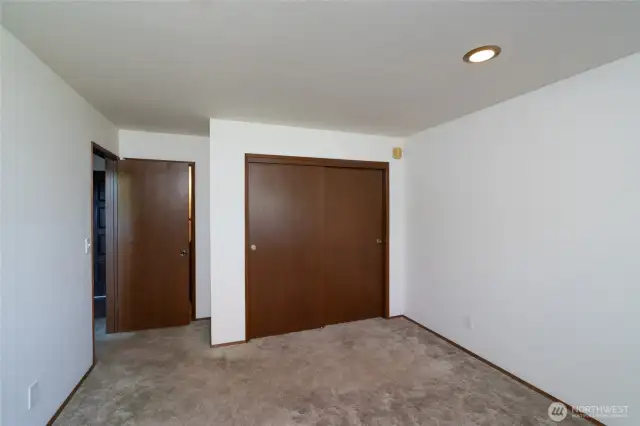 Main floor primary bedroom, en-suite bath just behind door ahead.