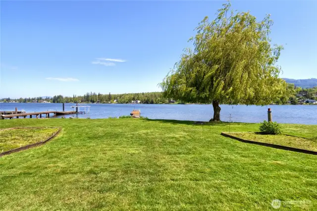 Spacious backyard is level and offers 75'of no bank waterfront.