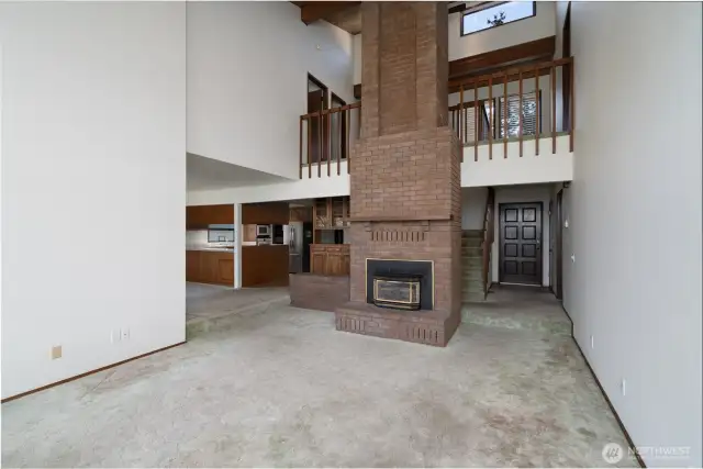 Dramatic gas fireplace and wood mantle. perfect for warming up after a dip in the lake!