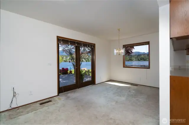 French doors lead to backyard deck made of composite material for low maintenance and easy cleaning.
