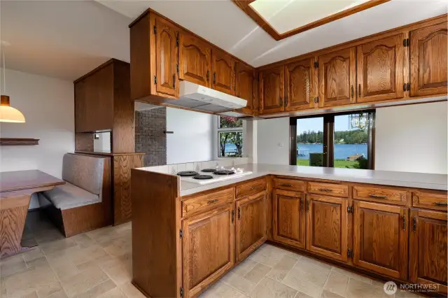 Kitchen offers ample counter space and real wood cabinets.