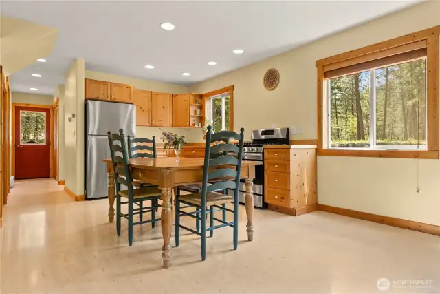 Pen-concept kitchen, dining, and living area